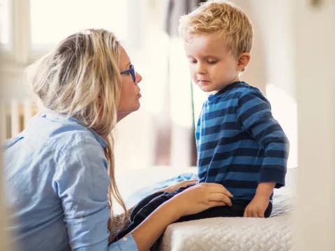 A mother talking with her son.