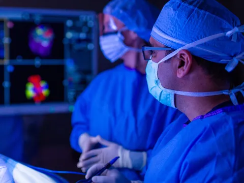 Neuro surgeon performing surgery.