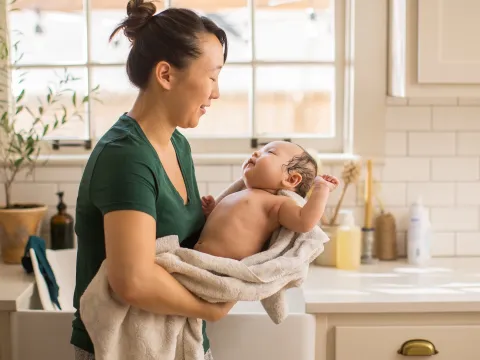New Mom gives baby a bath