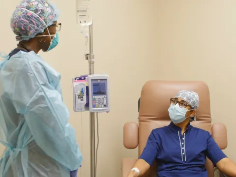 clinical employee speaks to a patient reviving a bamlanivimab infusion in Ornage City