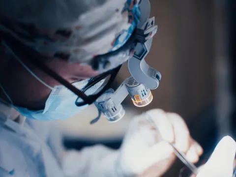 A surgeon performing reconstructive surgery.
