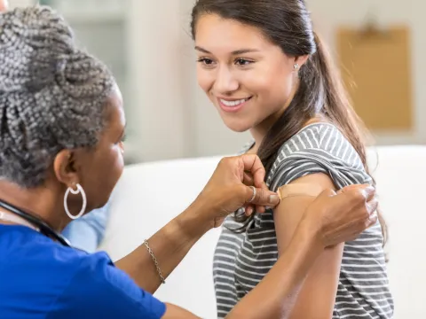 A woman receiving a vaccination