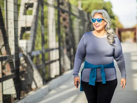 Smiling Woman Walking Outdoors