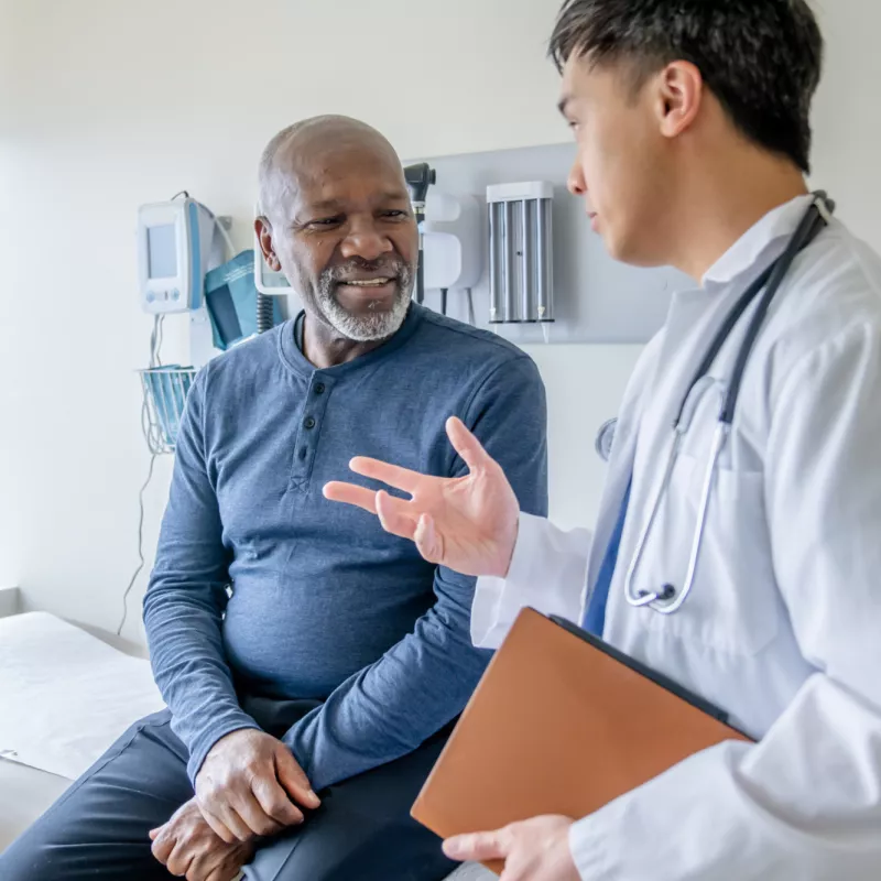 A Doctor Speaks to a Senior Couple About Their Health