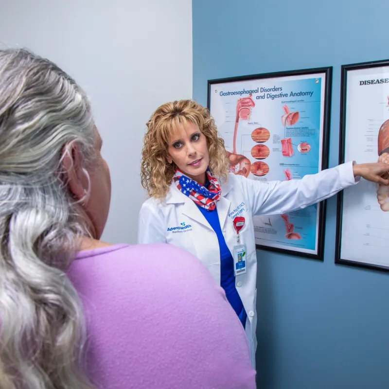 Dr. Sharona Ross explaining digestive track diagram to a patient