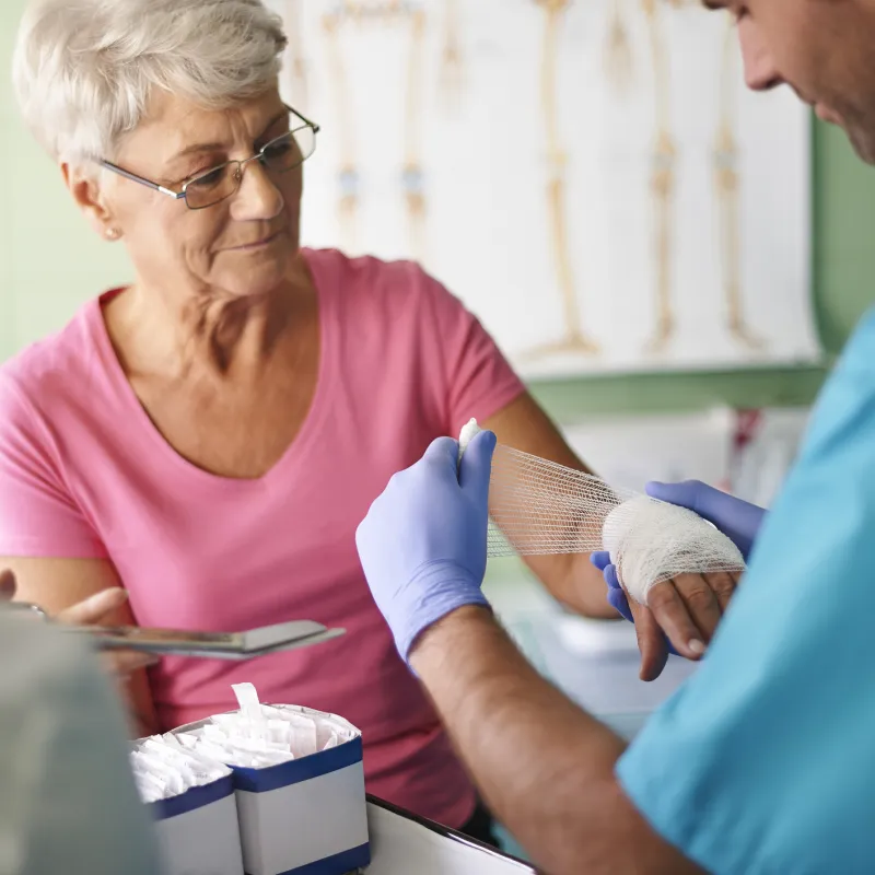 A woman receives treatment for a burn at the emergency room.