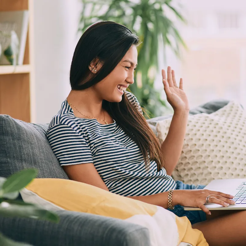 A woman video chatting with her family.