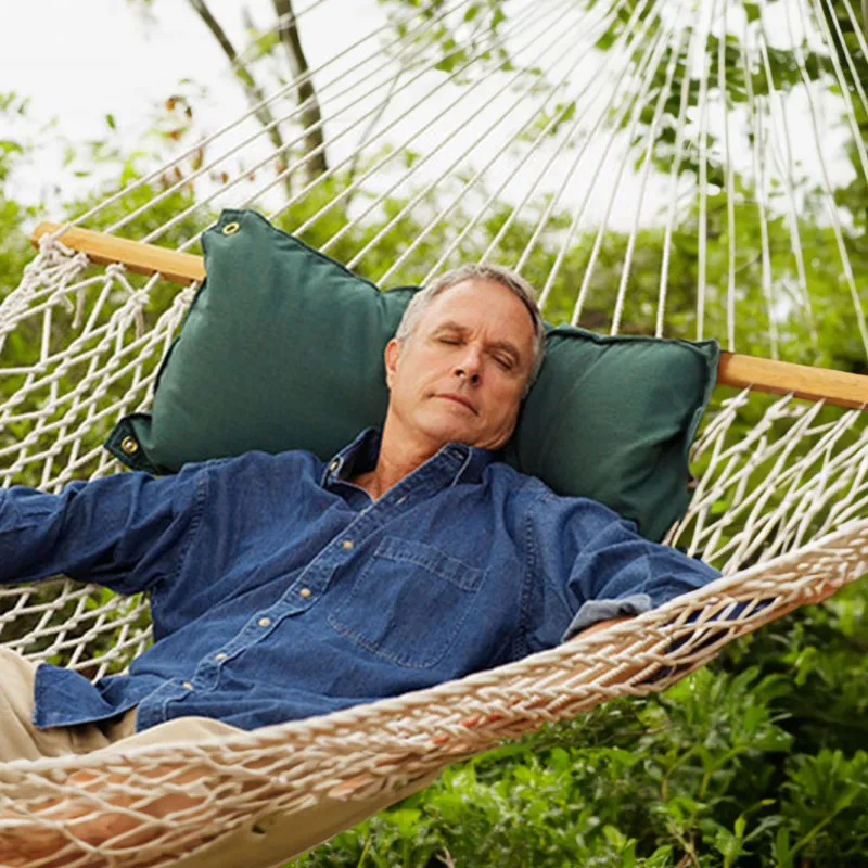 man-resting-in-a-hammock