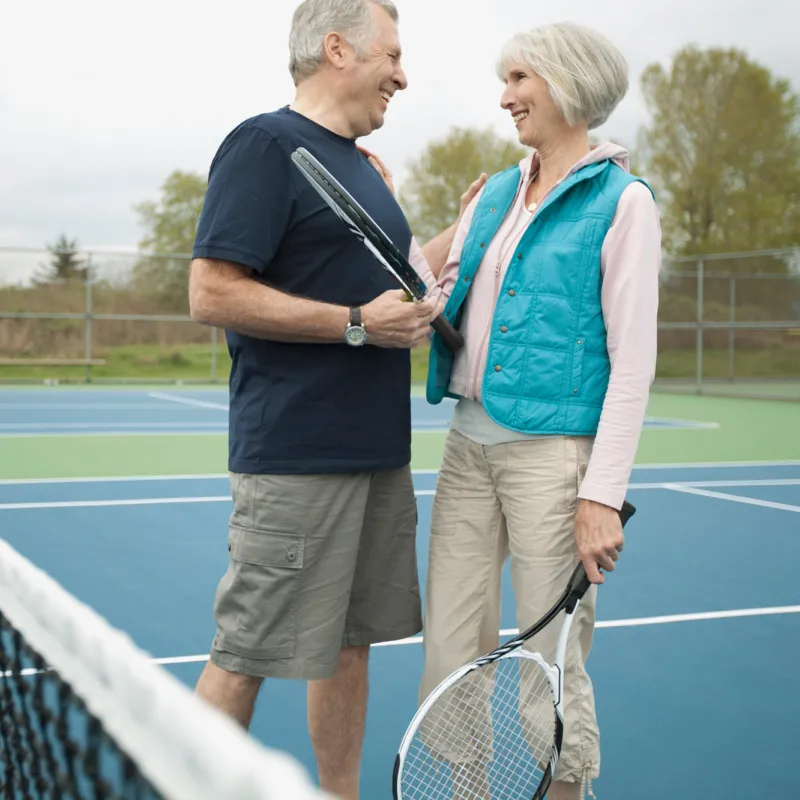Senior couple playing tennis