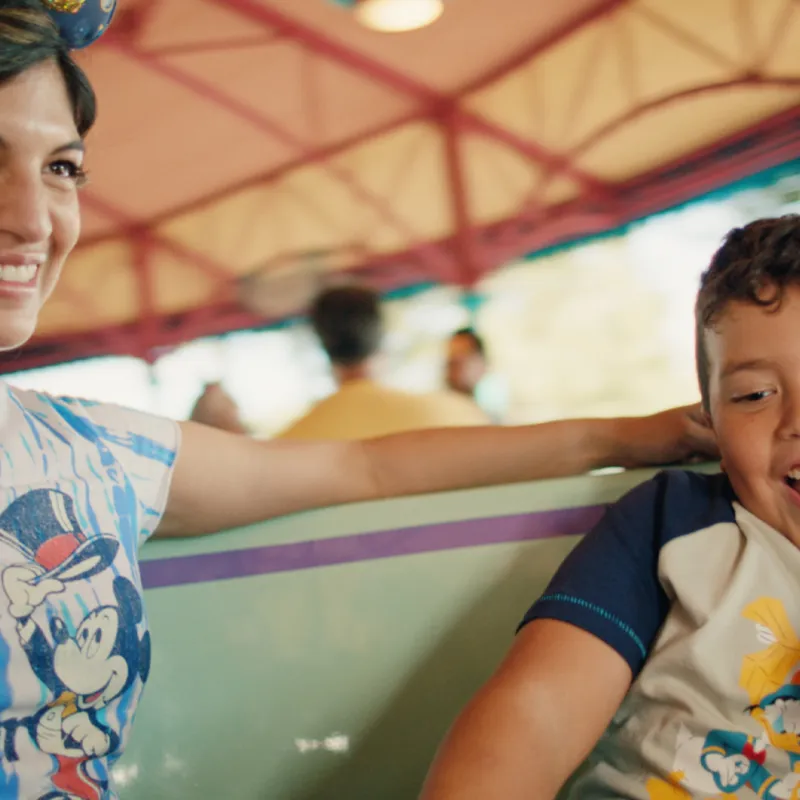 Mother and son riding Mad Tea Party at the Magic Kingdom at Walt Disney World Resort.
