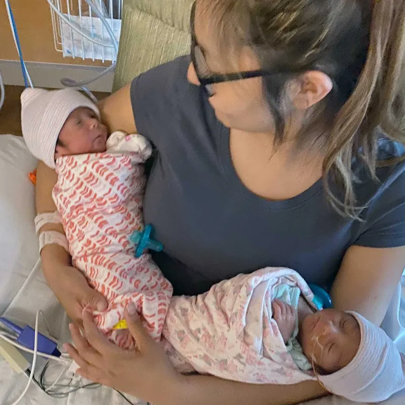A mother holding her newborn child