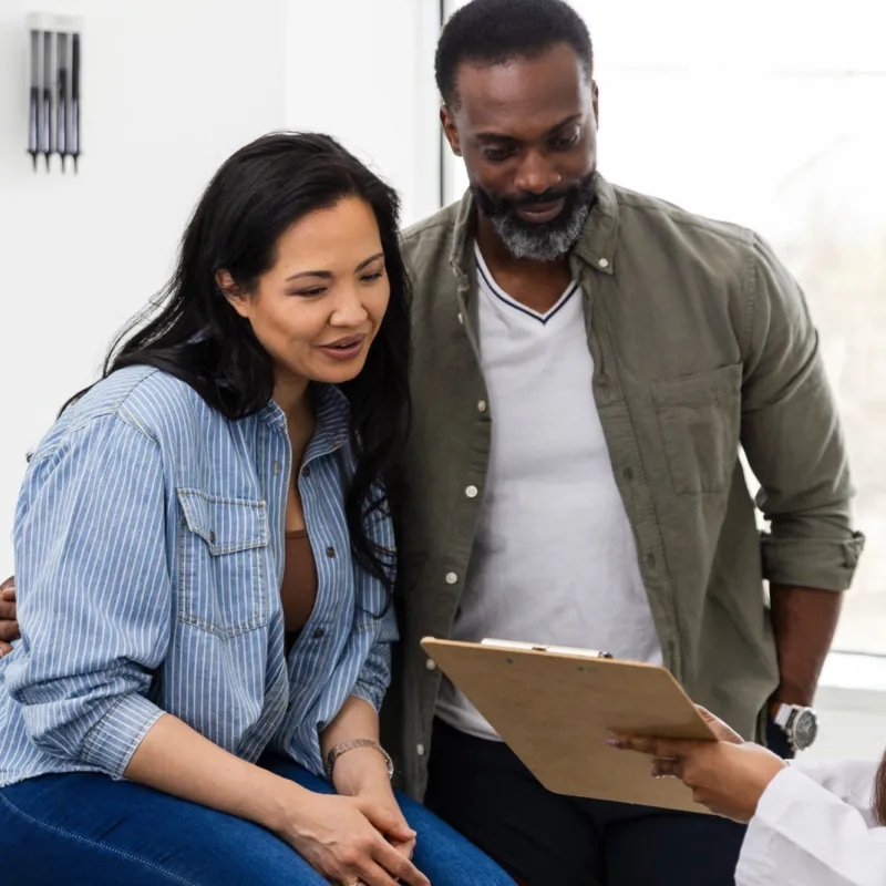 A couple talks with their doctor about family planning.