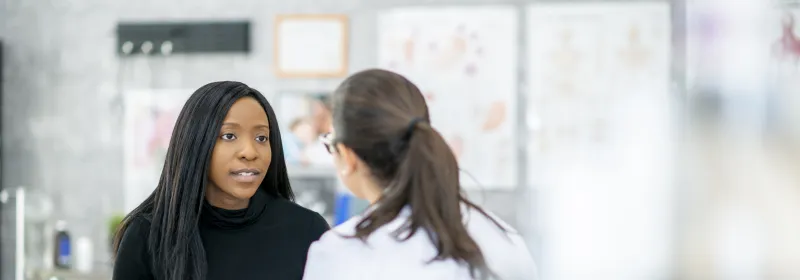 Millennial woman with primary care doctor