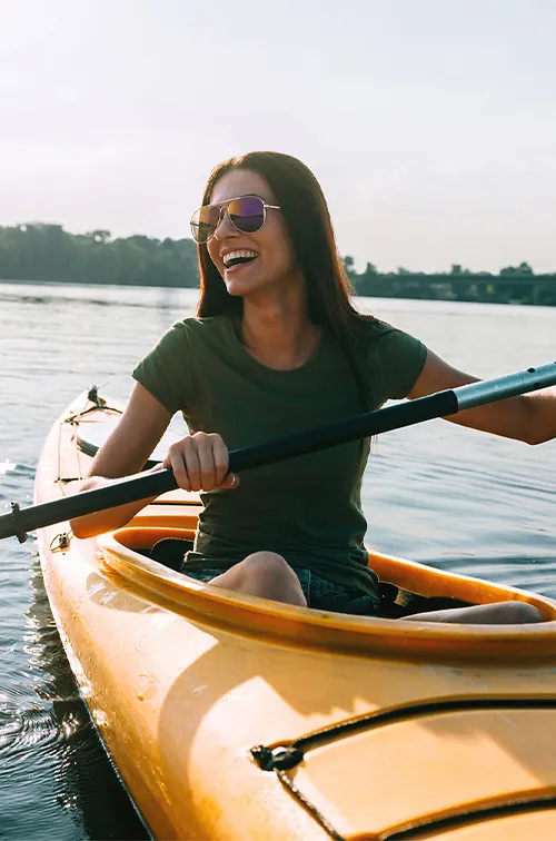 Couple kayaking outdoors together.