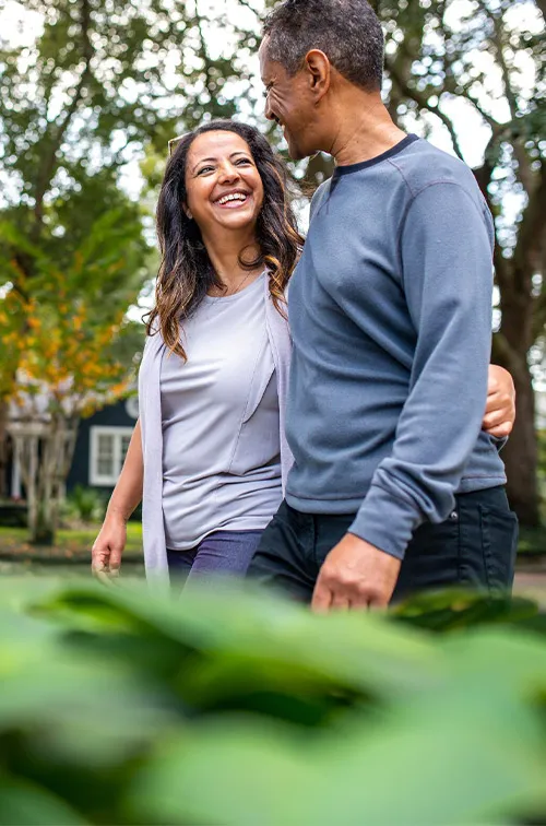 Man and woman walking in neighborhood