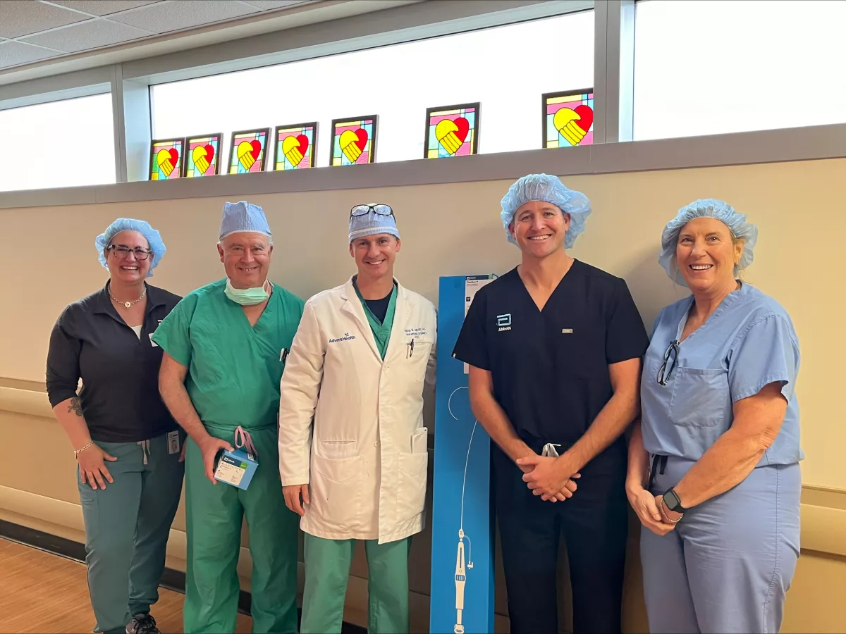 Dr. Rodrigo Do Lago (middle), Dr. Jorge Suarez (second from left) and Dr. Nipun Arora (not shown) with team who performed first in Central Florida Abbott Navitor TAVR procedure on March 13, 2024.