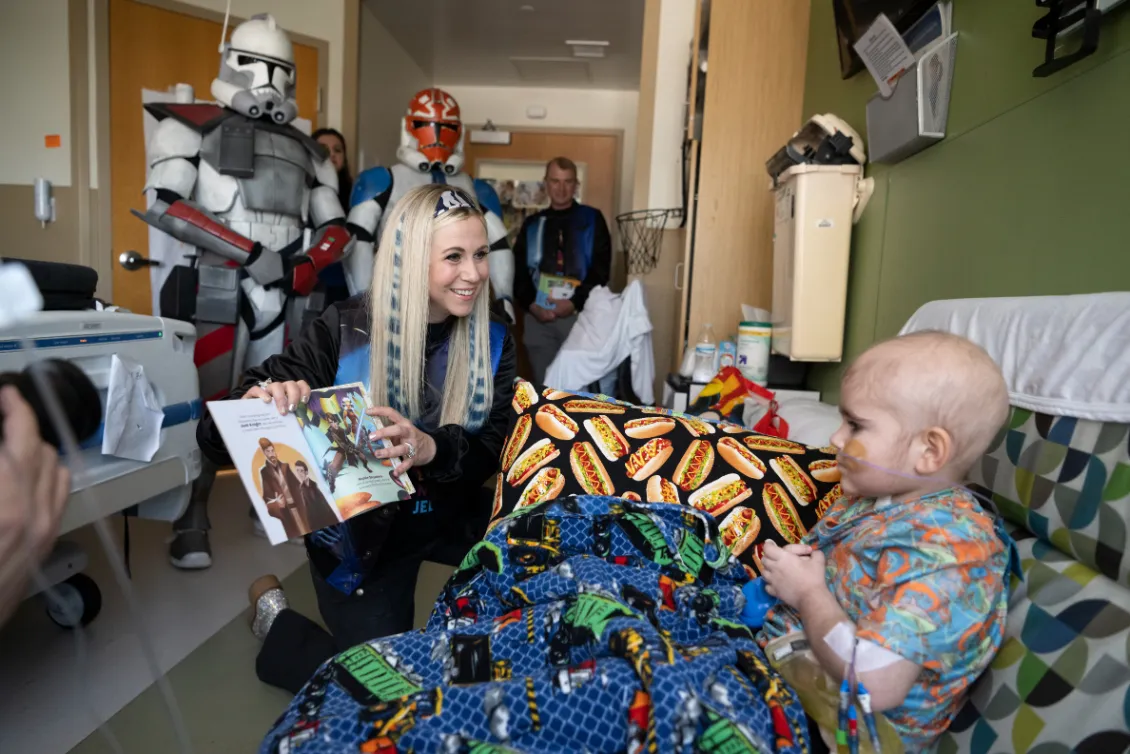 Ashley Eckstein, voice of voice of Star Wars’ Ahsoka Tano, read to a patient at AdventHealth for Children.
