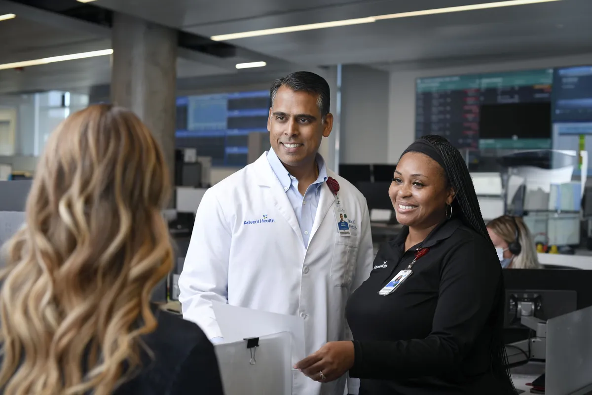 Dr. Sanjay Pattani works with Mission Control staff to improve care coordination across the hospital system.