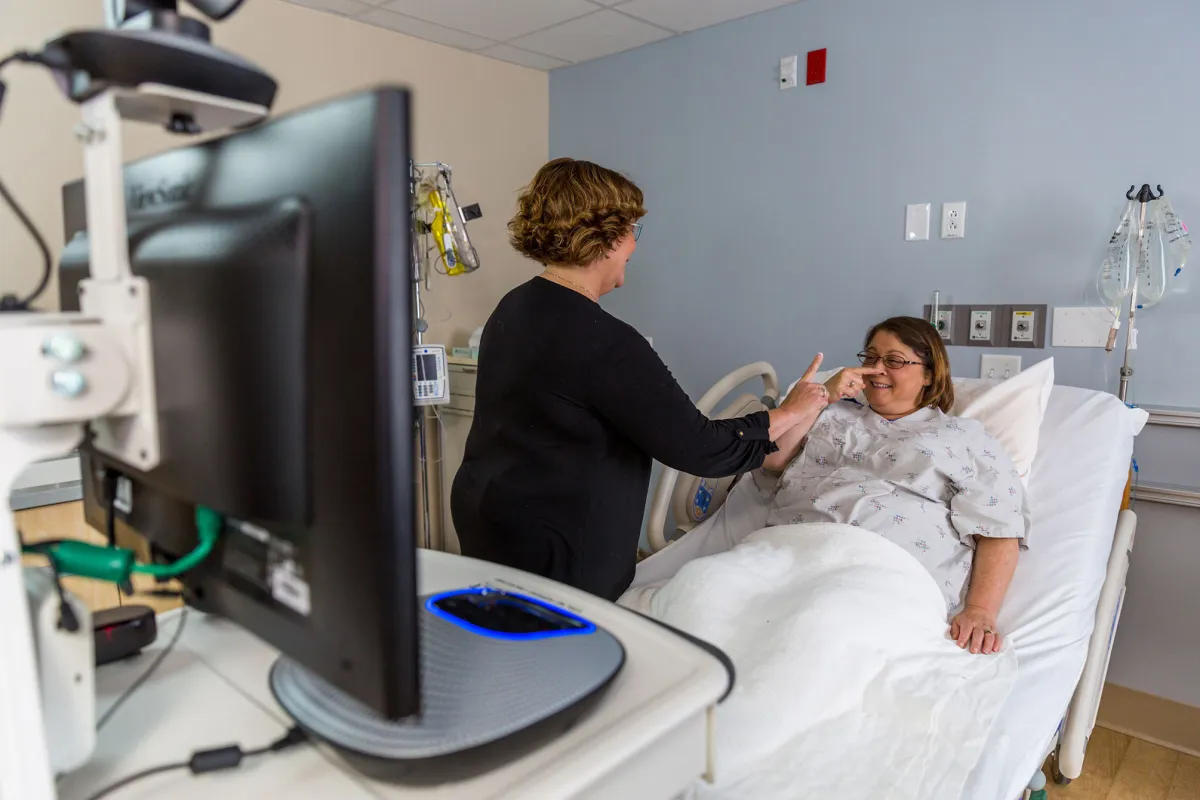 A visitor and patient having a conversation